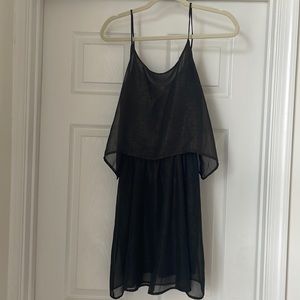 Black dress with gold glitter details. Size small.